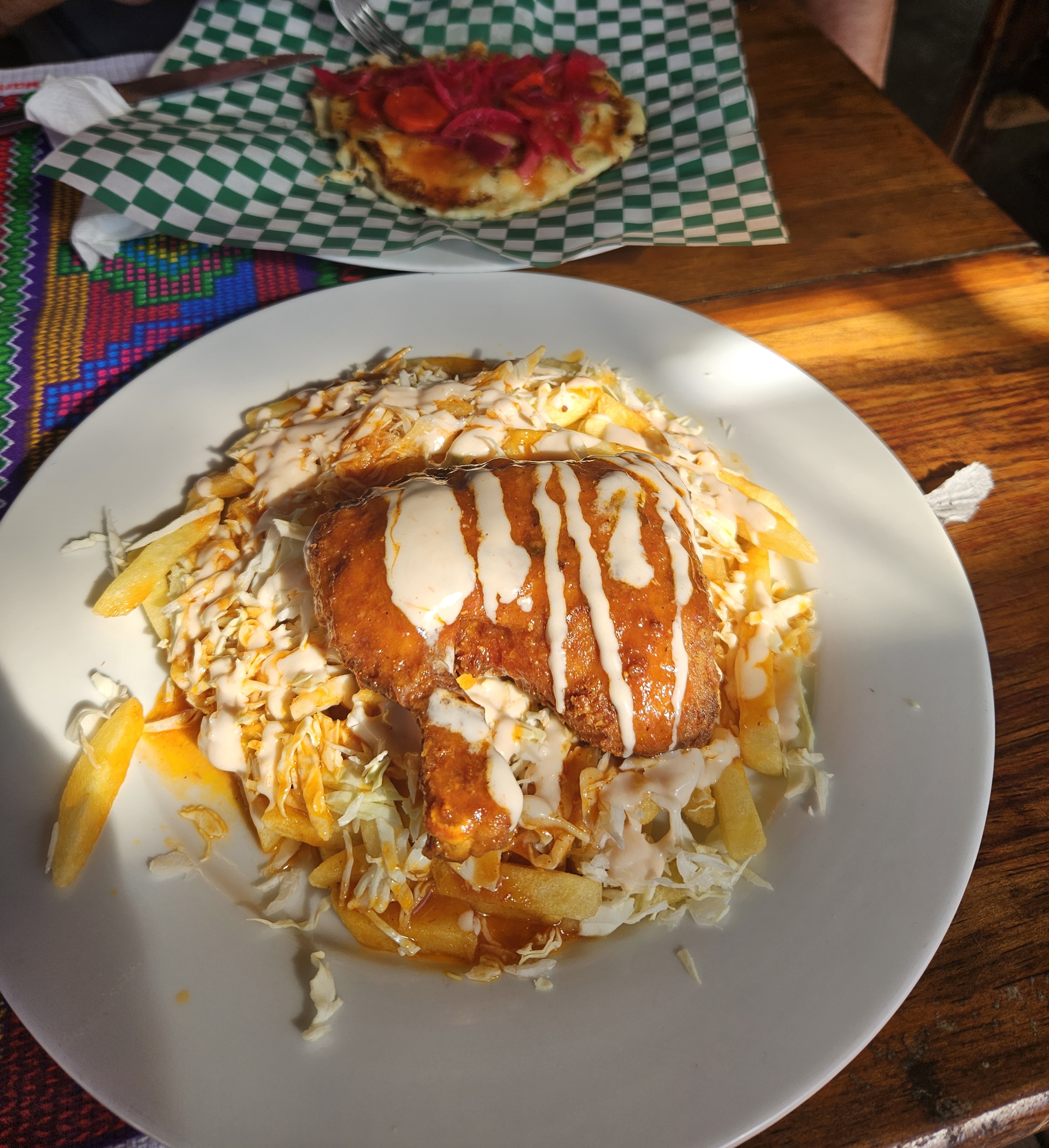 Traditional Honduran pollo chuco and baleada served at a local restaurant in Roatan